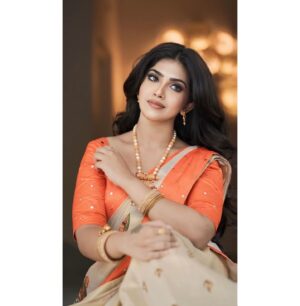 Varsha Viswanath Instagram - Happy Vishu 🧡

📸- @_prasanth_sivadas_ 
Hair - @makeup_by_sabana_ 

.
.
.
.
.
#happyvishu