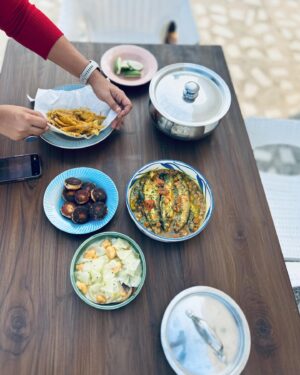 Varun Grover Instagram - Got super busy right after this day (as my standup solo India tour ended and @allindiarankmovie promotions began) but this day in Kolkata was the most joy-filled core memory of recent times. Spent a day in awe of the love for food and stories (and stories told through food) cooked by @bongeats (Insiya and Saptarshi). @sreemoyee.singh joined us for the relaxed, wholesome winter lunch - and WHAT A LUNCH it was! 

1. Insiyar Sansar. 

2. Aamudi fish bhaaja being finished by Saptarshi while Insiya tempers the silent-rockstar of the meal, Masur Daal. 

3. The table being laid. Narkel Bora, Pepe Shukto (Shukto made with Raw Papaya) Aamudi bhaaja, Pabda’r Tel Jhol, and inside the box - the most royal Chitol Machher Muitha. 

4. A closer look at Pabda’r Tel Jhol, with the most delicate-crunchy boris on top. Teasing from the corner in the back, the palette cleanser Imli Chutney/Jhol. 

5. Saptarshi brings in the daal. 

6. Bong Eats before they eat. 

7. The assorted mishti spread from assorted legendary shops around. 

8. We also realised that Insiya and I share our birth date (26th January) and just by chance, Sreemoyee had brought a freshly baked, very unique Pear cake. So of course we cut it on this day, 27th January. 

9. Filmmaker and singer @sreemoyee.singh, Insiya, Saptarshi, and I with - happy food-coma glow binding us together. 

27th January 2024.

(All pics by me except the cake-cutting one clicked by @sreemoyee.singh.)