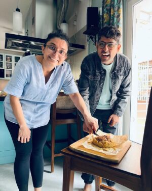 Varun Grover Instagram - Got super busy right after this day (as my standup solo India tour ended and @allindiarankmovie promotions began) but this day in Kolkata was the most joy-filled core memory of recent times. Spent a day in awe of the love for food and stories (and stories told through food) cooked by @bongeats (Insiya and Saptarshi). @sreemoyee.singh joined us for the relaxed, wholesome winter lunch - and WHAT A LUNCH it was! 

1. Insiyar Sansar. 

2. Aamudi fish bhaaja being finished by Saptarshi while Insiya tempers the silent-rockstar of the meal, Masur Daal. 

3. The table being laid. Narkel Bora, Pepe Shukto (Shukto made with Raw Papaya) Aamudi bhaaja, Pabda’r Tel Jhol, and inside the box - the most royal Chitol Machher Muitha. 

4. A closer look at Pabda’r Tel Jhol, with the most delicate-crunchy boris on top. Teasing from the corner in the back, the palette cleanser Imli Chutney/Jhol. 

5. Saptarshi brings in the daal. 

6. Bong Eats before they eat. 

7. The assorted mishti spread from assorted legendary shops around. 

8. We also realised that Insiya and I share our birth date (26th January) and just by chance, Sreemoyee had brought a freshly baked, very unique Pear cake. So of course we cut it on this day, 27th January. 

9. Filmmaker and singer @sreemoyee.singh, Insiya, Saptarshi, and I with - happy food-coma glow binding us together. 

27th January 2024.

(All pics by me except the cake-cutting one clicked by @sreemoyee.singh.)