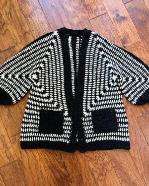 Vickie Howell Instagram - I cannot even remember the last time I’ve had the chance to knit or crochet an entire garment for myself, purely for the sake of making. I’m so happy to have this graphic beauty as part of my black-and-white wardrobe era. 😜

📝Daley Hex Cardi by @sarao_designs

👷‍♀️Modifications: I added about 6” in length to the body, granny square pockets, and knit rib sleeve cuffs 

🧶 Leftover Woolpaca from my discontinued, co-branded yarn lines with Deramores

#memade #crochetersofinstagram