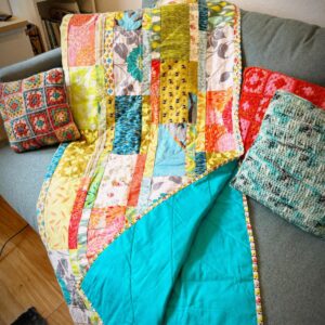 Vickie Howell Instagram - Not to brag, but I just finished the quilt for my highschool freshman’s toddler bed! 👏🏼

In other words, I now have a quilt for the couch in my home office (because there’s nothing about these colors that my teenager would find even vaguely acceptable today.) 😝 

#betterlatethannever