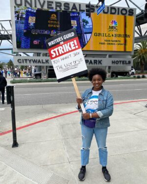 Yaani King Mondschein Instagram - Joined the picket line at Universal yesterday with my dear friend and incredible writer @marlanahope. There are stacks of signs you can choose from that other writers have made in weeks past, and we found this one that read “You haven’t seen THE LAST OF US!”! It felt divinely inspired. 😉 Met some wonderful people and had some really great conversations. Solidarity takes many forms and I’m looking forward to continue showing mine in any way I can. We really are stronger together. 
#SAGAFTRAstrong #WGAstrong #1u