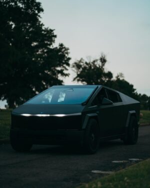 Yelawolf Instagram - sittin on the tail gate of a different kinda box these days .. @teslamotors Foundation Series Cyber Truck .. aye you can’t have War Story without a fighter jet in the drive way .. that black on black SLUMERICAN stealth bomber … I named her Temples Chariot !!!! CARS CARS FANCY CARS !!!! 🎥 @visualsbytyre #slumerican #tesla #cybertruck