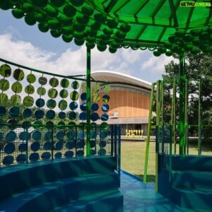 Yinka Ilori Instagram - Meanwhile in Berlin 🇩🇪 opening today is the new pavilion ‘Reflection in Numbers I designed for @hkw_berlin 🪕🪕🪕 
:
The pavilion Reflection in Numbers by British-Nigerian multi- disciplinary artist and designer, Yinka Ilori MBE, invites visitors to embark on a critical and artistic journey that explores the complex themes of racism in sports and personal accountability.
The pavilion will officially open on 7 June as part of
HKW’s festival Ballet of the Masses—On Football and Catharsis.
:
Ilori’s work is underpinned by the assertion that ‘the audience must be held accountable for their actions’. What does accountability really mean, to all of us? And what forms can a response to being held accountable take?
:
This year’s pavilion is not just an artistic representation but a critical examination of issues related to racism in sports. Through its architectural design, it places a deliberate emphasis on the experiences of players who, through football and sports in general, are in a constant state of oscillation between a sense of belonging and the fear of radical exclusion.
:
The pavilion raises questions on how to deal with racist and discriminatory chants that too often can be heard from the stands at football games. Design elements like mirrors are used in the interior of the pavilion as an impetus for self-reflection and serve as a tool to remind the visitor of their own accountability in perpetuating a culture of exclusion. The round shape of the stadium-like structure means visitors are surrounded by mirrors, no matter where they stand on the inside. Even when standing alone in the pavilion, the mirrors give the sense of being watched by a mass—a multiplication of oneself. By entering this space, the visitor agrees to experience an unusual form of self-consciousness.
:
thank you to the visionary @bonaventurendikung and @fernandeart for trusting me for the second time ❤️ long may our collaborations continue. And a huge huge thank you to my incredible small but mighty team in working with me in bringing this to life 🪕🪕