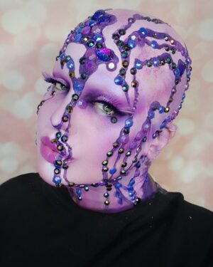 Yvonne MacInnis Instagram - 🔮☔️ PURPLE REIGN ☔️🔮

Giving the children what they want in this 1 hour quick paint challenge!! Damn I was freaking out on the inside but did my best not to let em see me sweat!! 

Join me on ig next week at 7pm EST for a LIVE virtual viewing party 🎉  for the season finale of @paintedwithraven and a MAJOR ANNOUNCEMENT!!! 😈☔️🔮

@worldofwonder @wowpresentsplus @rupaulsdragcon @paintedwithraven 
#makeupartist #makeupcompetition #makeupartists_worldwide #creativemakeup #creativemakeupartist #makeuplooks #purplemakeup #avantgardemakeup
