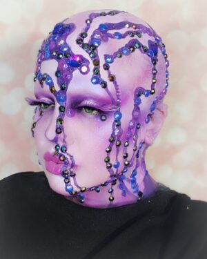 Yvonne MacInnis Instagram - 🔮☔️ PURPLE REIGN ☔️🔮

Giving the children what they want in this 1 hour quick paint challenge!! Damn I was freaking out on the inside but did my best not to let em see me sweat!! 

Join me on ig next week at 7pm EST for a LIVE virtual viewing party 🎉  for the season finale of @paintedwithraven and a MAJOR ANNOUNCEMENT!!! 😈☔️🔮

@worldofwonder @wowpresentsplus @rupaulsdragcon @paintedwithraven 
#makeupartist #makeupcompetition #makeupartists_worldwide #creativemakeup #creativemakeupartist #makeuplooks #purplemakeup #avantgardemakeup