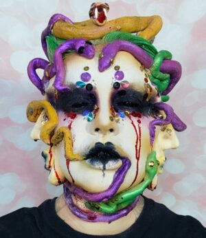 Yvonne MacInnis Instagram - Category is SHOCK IT TO ME 😲on this weeks episode of @paintedwithraven and that we did… 
 🤡👺👻😈👽🎭🤪It’s the SEMI FINALS and you’re not going to believe what happened with this triple headed creature I sculpted and painted the whole damn thing in 3 hours.. and still have to paint for my LIFE!!!! 

@paintedwithraven @itsravenhunty_ @wowpresentsplus @rupaulsdragcon @yvonnetheartist @flawless.shade @brycerider @crimsyn.co @ryanmarie__ @jordanjmua 
@worldofwonder
