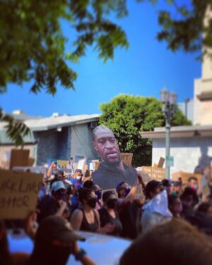 Zachary Quinto Instagram - marching in the streets of hollywood today i saw this photo of george floyd being carried high above the rest of the people and signs. it felt like he was looking right at me... right through me really. fixing his gaze on all the places within me where i have fallen short. stayed silent. taken care of myself first. thoughtlessly perpetuated generations of ingrained white privilege to the detriment of my brothers and sisters of color. and it immediately restrengthened my resolve to support this movement in any and every meaningful way i can. not only today among the throngs. but in the weeks and months and years ahead. to learn and grow and do the work and show up in solidarity... lasting solidarity. i felt his presence among us today. his spirit moving all of us down hollywood boulevard. and i felt sure in this moment that we will not let his death be in vain. 
#blacklivesmatter 
#defundthepolice 
#sayhisname 
#justiceforgeorgefloyd