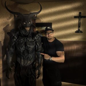 Zak Bagans Instagram - I just acquired the ORIGINAL DEMON prop used in the filming of the Conjuring 2 movie.  Very interesting story behind this: This “horned demon” was designed by director James Wan (see in 3rd pic) and Justin Raleigh…It is a whole animatronic suit which would have had VFX demonic wings. Wan decided to shift gears after filming several scenes with this horned demon(see one scene in 2nd pic) and while in post-production he decided to replace it with the Valak/demon nun because he felt this Horned Demon wasn’t personal enough for Lorraine Warren. Wan would state on his Instagram “This was the best demon I never used” (see IG video posted by Wan on set with this horned demon)… it’s ok James, I found an incredible use for it as it will now be appropriately on display in The Haunted Museum’s “Devil’s Rocking Chair” exhibit which inspired the Conjuring 3 film. Added- This is an extra disturbing piece because this is exactly what the horned demon looked like in my dream one week before I bought the Demon House and started filming the documentary in Gary, Indiana.
