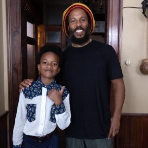 Ziggy Marley Instagram - Ziggy and Ziggy . Meeting and watching my younger self from @onelovemovie was a joy. Meet Xavier Woolry from Charles Town Buff Bay, Portland #Jamaica 🇯🇲 .
He attends Charles Town primary school 
and is a part of the Charles Town Maroon drummers and dancers group 
He loves to play football 
He’s in the drama club at school.
I tell you, all the children in this film were amazing . They did a great job . It was so heartwarming watching these young Jamaican kids get a chance to experience something new and be so good at it. They are a part of history and they left a positive and inspiring impression on all us adults . I know the future is bright with kids like Xavier leading the way. I am thankful to all the children and their families for being a part of #bobmarley #onelovemovie . JAH guide them on their journey 🙏🏾🙏🏾🙏🏾❤️❤️❤️