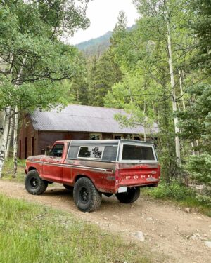 Aaron Kaufman Instagram - Short little impromptu camping trip. First one Ol’ RedFord has been on. Camped on two rivers drove up to the ghost town and bumbled up tin cup pass for a mile or so (not enough fuel to make the pass and water at 30” RedFord only has a fording depth of about 24” currently) still had a great time and RedFord was great not a single issue. 
Surprisingly RedFord gets 15mpg on 37s 5.13 gears and a full load  at elevation. Additionally the @mcleod_racing clutch and heavy flywheel make driving and old manual farm truck in the rocks not nearly as much of a chore… win for a stick shift. 
Plus a got a new camper well, new to me with all of its holes 😂 I never tested the bed size on these trucks after I cut them down so I learned that a shell off of the next gen and up to 96 fit. I had my expectations but it was cool the shell fit well. 

#magnaflow 
#mcleodclutch 
#precisionreplacementparts 
#colorado