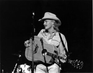 Alan Jackson Instagram - “’Cause all I’ve ever wanted is to pick this guitar and sing.” #ChasinThatNeonRainbow #TBT