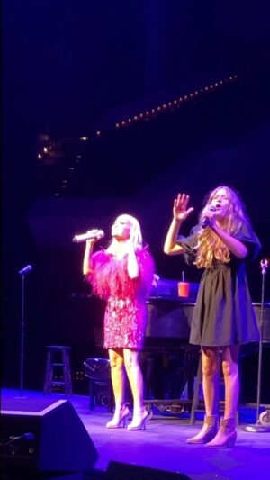Alan Powell Instagram - I just couldn’t be more proud of my oldest, AJ. Got up there and sang “For Good” with the incomparable @kchenoweth and did it like she’s done it a hundred times before. She has that rare gift of being able to use nerves in her performance instead of letting the nerves keep her from her performance. It’s rare. She loves the stage and the stage loves her back. 

Thank you so much to my friend, @kchenoweth for inviting her to sing with you.. was genuinely a moment AJ will never forget.. and I won’t either. 

#proudfather