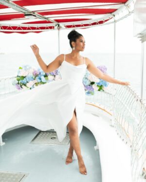 Alana Monteiro Instagram - Free 🦢 

P.S the tan lines on my feet are from @birkenstock sandals 😜

Concept/Design: @sarueeventdesign
Venue: @chanticleernantucket
Boat: @nantucketbywater
Photography: @britperkins_
Videography: @sofiya.luna.weddings
Floral Design: @_buds
Tabletop Rentals: @curated_rentals 
Furniture Rentals: @dez.collective
Linens: @nuagedesignsinc
Styling: @juliematosstyle
Makeup Artistry: @bombchellebeautymua / @bridalbeautybymadelyne
Hair Styling: @saraibyday
Dress Designer: @bremelia
Jewelry: @capeology
Jewelry: @thediamonddoornantucket
Grazing Table: @grazingcapecod
Cake: @loveand.flour
Custom Cookies: @sweettreatsbymariarose
Stationery: @maxandmaidenink
Calligraphy: @bl_calligraphy
Cocktails: @thewanderingbartender_ 
Bridal Model: @alanamonteiro_ / @modelclubinc
Groom Model: @connorweathers22
Bridal Model: @mackenzie.lillian88
Groom Model: @ivan_georgiev3