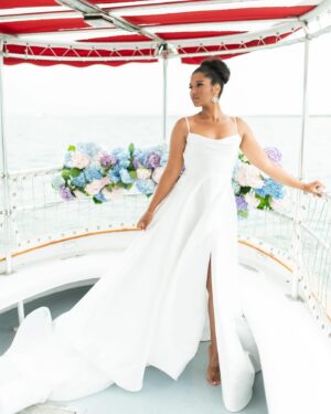 Alana Monteiro Instagram - Free 🦢 

P.S the tan lines on my feet are from @birkenstock sandals 😜

Concept/Design: @sarueeventdesign
Venue: @chanticleernantucket
Boat: @nantucketbywater
Photography: @britperkins_
Videography: @sofiya.luna.weddings
Floral Design: @_buds
Tabletop Rentals: @curated_rentals 
Furniture Rentals: @dez.collective
Linens: @nuagedesignsinc
Styling: @juliematosstyle
Makeup Artistry: @bombchellebeautymua / @bridalbeautybymadelyne
Hair Styling: @saraibyday
Dress Designer: @bremelia
Jewelry: @capeology
Jewelry: @thediamonddoornantucket
Grazing Table: @grazingcapecod
Cake: @loveand.flour
Custom Cookies: @sweettreatsbymariarose
Stationery: @maxandmaidenink
Calligraphy: @bl_calligraphy
Cocktails: @thewanderingbartender_ 
Bridal Model: @alanamonteiro_ / @modelclubinc
Groom Model: @connorweathers22
Bridal Model: @mackenzie.lillian88
Groom Model: @ivan_georgiev3
