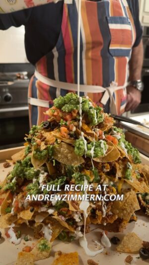 Andrew Zimmern Instagram - What’s better than a towering platter of fully loaded, flavor-packed nachos? 🔥 I can’t think of anything … especially when you consider the scratch-made salsas, the chorizo, the mix of cheeses and a healthy dose of my @badiaspices Mexican Fiesta seasoning. 

This is just a template, feel free to riff off it with whatever suits your taste.

Pick up my entire Badia Spice line at at your local @krogerco, on andrewzimmern.com/spices, or on bodega.badiaspices.com. Full recipe is at the link in my bio, PLEASE try this one at home and tag me in the posts! 

And make sure you’re subscribed to my YouTube and Substack so that you’re the FIRST to get these recipes.