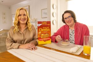 Angela Kinsey Instagram - I had such a great time joining my old pals to partner with @cheerios . We obviously had a lot of fun (and cereal) shooting these commercials! Watch the air waves for our silliniess with Buzz while sharing delicious Cheerios🧡. #AD🥣