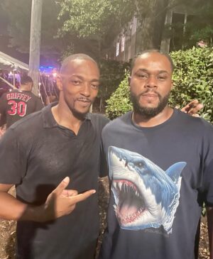 Anthony Mackie Instagram - 🦈🦈🦈🌊 Sharks in the water!! Look who @imarketideas  ran into @anthonymackie this years host for Sharkfest airing June 30 - July 28.  Appreciate the support your Shark Tee and Louisiana Tee are in the mail‼️🦈🦈🦈🌊 link in bio…shop masterpiecetees.com