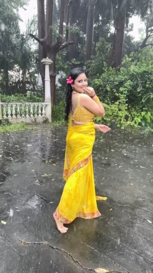 Archana Gupta Instagram - She loves the rain, each drop a kiss,
In the downpour, she finds her bliss.
A jolly soul where peace is found,
Barefoot she twirls on rain-soaked ground. 

Simply A happy heart forever free 💞
.
@sunidhichauhan5 @shashwatology 
@cokestudiobharat Lovedddd this track ❤️ .
.
.
.
.
.
.
.
#trendingaudio #cokestudiobharat #artist #archanagupta #sareelove #raindance #bts #rain #love #laugh #status #reelsindia #sareeaddict #trendingreels #foryou #explore #dancereels #enjoylife #dancingintherain #freesoul #indianbeauty #instareels #mumbairains