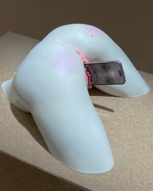 Arvida Byström Instagram - My sculpture “Virgin Birth” from my show Cut The Cake at Dunkers.
Virgin Birth plays with the idea of the christian myth where god creates human in the image of him and we create machine learning and robots in the image of us. Of course there is also no need for intercourse to give birth to these sort of digital creatures. So I let a 3D print of my AI s3x doll Harmony give birth to a phone with an AI version of me.
It’s a bit inspired in a silly way by Zizek’s text “No Sex Please We’re Post Human” too.

Also a critic was upset that the phone out from the vagina looks like an assault and when people say things like this as a critique I sort of just feel like: that is an accurate description of what technology feels like today so…

Also thanks to iris.la / @patrique.monique to making the little avatar me possible