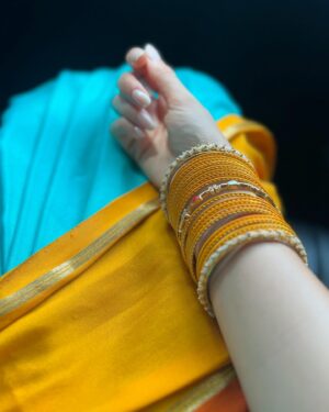 Ashika Ranganath Instagram - Wedding vibe check :) 
Don’t forget to slide through to see me show off my bangles & mallige hoo/ malli poo🤍
Styling, make up, hair, draping by yours 💁🏻‍♀️