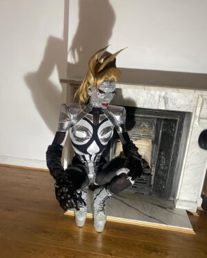Black Peppa Instagram - “And when you become a diamond, you’ll understand why life had to put pressure on you.” 

My first post for 2023! Saying that 2022 was an amazing year would be an understatement. Not only was it life-changing, but also filled with growth and maturity in my queer journey. After the Drag Race finale, I took it upon myself to place my mental health in the forefront and to do so I had to make some tough decisions before entering 2023.

Unfortunately I’ve always been a people pleaser and this got in the way of me truly living. I’d say it’s the way I was raised. It was truly hard for me to watch the show back episode after episode because although I was fully being myself, I saw that young Caribbean boy fighting his inner demons; insecurity, shame, timidity, and self doubt. 

I’ve had to pull away from some circles, friends, family; all just to really focus on me and understand the way my brain is wired. Daily walks that lasted for hours on end, hiking in my local park and yelling to the top of my lungs, meditation that led to non stop crying and reconnecting with Akeem. 

Most people will never understand but to find balance in a busy life is seriously the most important thing one can do for themselves.
Ever since prioritising myself, the veil has been lifted off. My past trauma had me as the punching bag and it was time to face it head on. Anything that scares you, will change you …and trust me pain will change you. 

I feel an illuminating switch happen in my spirit and finally feel sweet release. It’s a feeling that I can in the best way describe as growth and purpose! I am ready to take on the world while doing what I love. MY happiness, MY joy, and MY well-being will always come first no matter what. Life will not throw at you what you can’t handle, trust the process 💎 ✨

Decided to redo this shoot I did with the fully rhinestone face in 2019 inspired by Jenna marbles. Thanks @dojacat & @patmcgrathreal for reigniting my creativity with the show-stopping red @schiaparelli look! 

Photographer: @ivantruewizard 
Retouching: @jordanwindows & @manuconejer0 
Space-age catsuit: @simonpreen 
Wig: @styledbyvodka 
Rhinestone heels: @joeyalantaylor & @trashyplanets