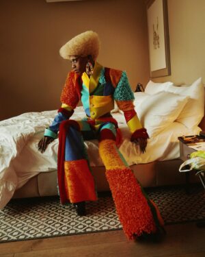 Black Peppa Instagram - BTS shots before heading to @frolovheart SHOW. Thank you @thelondoner 💖

LFW- LOOK 4- Wearing custom @christopherniari to attend the @frolovheart SHOW. Had this concepts for months where I’d use various fabrics with different textures particularly bathroom rugs, felt, suede, faux leathers and furs to create a groovy tailored high waisted pants suit. For this LFW it was also my priority to showcase more black hair styles and desired to style a blonde Afro myself. This was the first time I’ve styled any wig and was quite proud of the end result I must say.

Photographer: @kimlangstudio 
MUA: @jackoliverx using @theunseenbeauty 
Full look: @christopherniari 
Hair by me
Earrings: @nobasicbombshell
Money Nails by @nailsanthonys