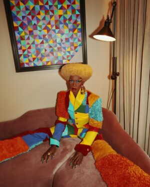 Black Peppa Instagram - BTS shots before heading to @frolovheart SHOW. Thank you @thelondoner 💖

LFW- LOOK 4- Wearing custom @christopherniari to attend the @frolovheart SHOW. Had this concepts for months where I’d use various fabrics with different textures particularly bathroom rugs, felt, suede, faux leathers and furs to create a groovy tailored high waisted pants suit. For this LFW it was also my priority to showcase more black hair styles and desired to style a blonde Afro myself. This was the first time I’ve styled any wig and was quite proud of the end result I must say.

Photographer: @kimlangstudio 
MUA: @jackoliverx using @theunseenbeauty 
Full look: @christopherniari 
Hair by me
Earrings: @nobasicbombshell
Money Nails by @nailsanthonys