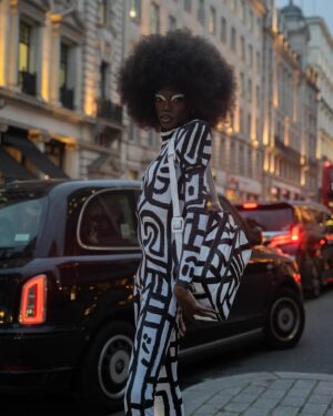 Black Peppa Instagram - London Fashion Week Look 1 - Part 1
LCF POSTGRADUATE SHOW 🦓

📸 @ivantruewizard 
MUA: @jackoliverx 
Catsuit constructed by @itsjust_joe and fully hand painted by moi 
Waist: corset by @misty_couture 
Heels: @hummingbirdheels spray painted and painted by me including handbag bought from a charity shop.

Makeup
@trixiecosmetics Hotline gel liner white on eyelids
Foundation: @kvdbeauty 
Setting powder and spray : @onesize 
@weledauk 
@maccosmeticsuk