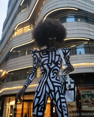 Black Peppa Instagram - London Fashion Week Look 1 - Part 1
LCF POSTGRADUATE SHOW 🦓

📸 @ivantruewizard 
MUA: @jackoliverx 
Catsuit constructed by @itsjust_joe and fully hand painted by moi 
Waist: corset by @misty_couture 
Heels: @hummingbirdheels spray painted and painted by me including handbag bought from a charity shop.

Makeup
@trixiecosmetics Hotline gel liner white on eyelids
Foundation: @kvdbeauty 
Setting powder and spray : @onesize 
@weledauk 
@maccosmeticsuk