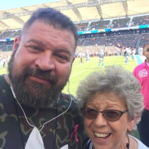 Brad William Henke Instagram - Me and mom - chargers broncos - I played for broncos but chargers gave me tickets 🏈💯