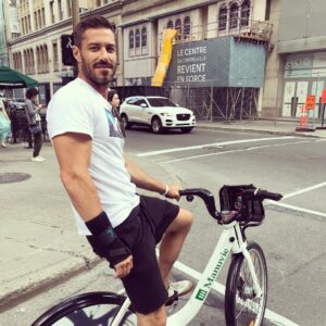 Brandon Quinn Instagram - One of my favorite things to do in Montreal is to rent bikes and ride for miles around the city, such a great and beautiful downtown.. This is a photograph of me on a rented bike riding miles around the city 🤷🏻‍♂️