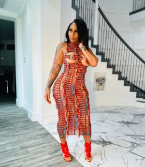 Brittney Bee Starr Williams Instagram - 🔥🔥Fire and desire🔥🔥 
Dress from @eleven22online 
Hair by @bluxlabelstudios