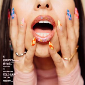 Brooke Alexx Instagram - “Younger Guys” is out today and after months of dropping hints, I can’t believe I’m finally sharing this huge secret… my debut album “Big Mouth” releases Oct 4 👄😭

In my bio, you can now pre-order the *limited edition* VINYL (omggg), which comes in translucent red and includes 3 bonus tracks that won’t be on streaming services!!! Get the vinyl alone or bundle it with all new merch I designed myself eeek! Anyone who orders a vinyl will receive a special CODE - you might want to hold on to that for later 🤭 

Photography: @peytoncdollar 
Makeup: @inkedxbrows 
Big Mouth logo: @thisisphangs 

I’ve poured my entire heart into every aspect of this project. My team and I have been working meticulously to make it as special as possible. I love you guys so much. This is only the first BIG announcement. Get ready ❤️ xx

Lastly, something is weird with my website again… would you mind checking that for me? 🧐🔒

Puzzle genius: @enigmida