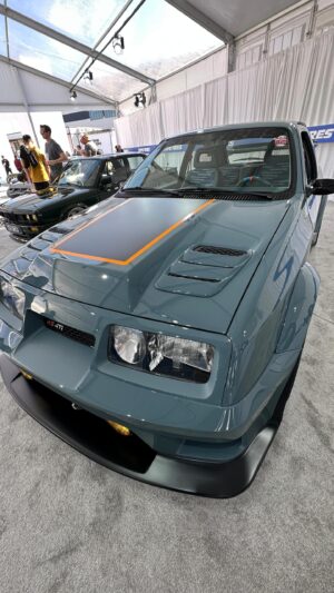 Bryan Fuller Instagram - @jh_restorations built this really sharp little 1987 Merkur one of the euro fords from back in that era.  Awesome to see this rarely customized car so well updated and restyled!  Greta job guys.  #semashow #sema2023 #sema #jhrestorations #fullermoto #customcars