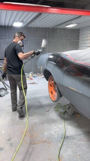 Bryan Fuller Instagram - Stoked to see some black going down on the #teslaswapped cougar!  For a black cat like this I like to use single stage as almost a primer to double check and refine all the surfaces.  So far so good she’s pretty damn straight!  Love this @sata_by_dan_am spray gun it just seems to know exactly what I want to do.  Trust in a tool can be everything as many of you know!  Enough of the break time for more coats!  #fullermoto #satasprayguns #evercoat #ingersolrand #custompaint #paintshop #indasausa #indasa #evswap