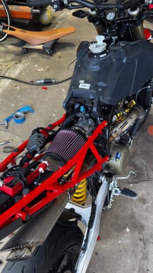 Bryan Fuller Instagram - Stripped the airbox off my #ducati #hypermotard this afternoon on a whim!  Kind of like tasty potato chips or bourbon I try to stay away but the temptation is too strong!  Putting a new @knfilters mention for a car more than likely on there just gave the throttle response, sound, and look a whole new raunchy vibe!  Not sure if it’s really faster or just feels that way but who cares I believe it which is what matters.  600 miles on this beast it’s about time for the first service hopefully the tune will hoon it even more!  #knfilters #ducatimono #ducatistagram #ducatimonster #ducatiusa #fullermoto #caffeineandoctane #hypermono #supermoto #supermotard #supermotards #custommotorcycle #motogp