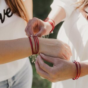 Caitlin McHugh Instagram - Today is National Human Trafficking Awareness Day

Each little red bracelet we are wearing here makes a world of difference for a survivor of human trafficking.

Rebecca Bender and Elevate Academy offers survivors a place to make their dreams a reality. Elevate is changing lives through awareness, legislation and education.

Wear this bracelet as a reminder that we stand up for humanity and we stand united interrupting exploitation.
10% off your purchase gives back to Elevate Academy
Handwoven in Kampala, Uganda