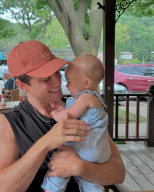 Carson Rowland Instagram - a baby, strawberry crocs, and some pinot boys