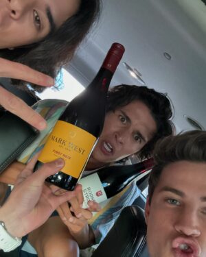 Carson Rowland Instagram - a baby, strawberry crocs, and some pinot boys