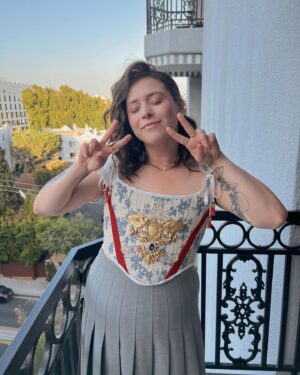 Casey McQuiston Instagram - tonight i received a tremendous honor: @taylorzakharperez told me i looked jacked 

just as importantly, i was reunited with my RWRB fam for an actual emmy fyc event for the movie based on my book!!! we never got to have our big red carpet premier last year, but baby we’re making up for it now! i cannot, even now, believe this is my life. wow. wowowowowowowwww!!!

styling: @dottttbass 
corset: @lucciaredesigns 
makeup: @itsnicklennon 
hair: @dwayne3ross