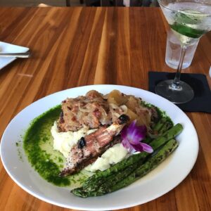 Charles Shaughnessy Instagram - Pork Chop, meet your “raison d’étre.” Superbly supported by escargots and the driest Hendricks martini. @thatplaceinogunquit delivers in style!