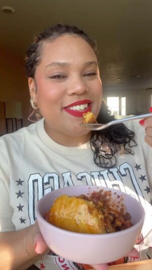 Chef Lovely Instagram - I added a few new ingredients but kept my Granny’s technique. Hope you enjoy my loves! Miss you, Granny 🕊️ #LoveYouLetsEat 

Ingredients (serves 4)
Chili
1/4 c diced onion
1/4 c diced bell pepper 
1/2 lb ground turkey 
2 tsp cumin & chili powder
2 Tbsp tomato paste
1 bulb roasted garlic 
15 oz canned beans, rinsed
14.5 oz can fire roasted tomatoes 
Cornbread
1 c cornmeal
1/2 c ap flour
1 tsp salt
2 tsp brown sugar
1 1/2 tsp baking powder
3/4 c milk
1 egg
4 Tbsp melted butter
1 c shredded cheddar cheese 
2 Tbsp pickled jalapeños, diced

Directions 
In a medium heavy bottomed pot, sauté the onion & bell pepper in olive oil over medium high heat for  2 min.

Add in the turkey, seasonings, and salt & pepper to taste. Sauté for 2 min.

Add in the remaining ingredients. Fill the tomato can with water or broth and pour that in. Gently stir. Bring to a simmer, cover and cook for about 30 min.

In a large bowl, whisk together the milk, egg, and melted butter. Set aside.

In a separate medium bowl, whisk together the flour, cornmeal, salt, sugar, and baking powder.

Pour the dry mixture into the wet, gently stir to combine, then fold in the cheese and jalapeños.

Make about 3-4 wells into the pot and fill with a spoonful of the cornbread batter. Cover each well with chili.

Pour remaining cornbread batter on top of the chili. Spread it out evenly with a spatula.

Bake in a preheated 415° oven for 25-35 min.

As soon as the chili comes out of the oven, glaze the top of the cornbread with warm honey butter. 

Cool for a couple of minutes then dive in! I like to serve sour cream, hot sauce, & sliced scallions on the side for guests to add if they want. Enjoy my loves 😘