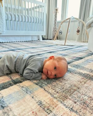 Chloe Bridges Instagram - Six months postpartum today 🤯🥹 Beau and I have giggled, cried, cuddled, had most of our hair fall out (y’all didn’t warn me about that one), grown, become better nappers, and learned a whole lot. He’s 2.5 weeks in the first slide and 5.5 months in the last… what do they say? The days are long but the years are short? I’m currently typing this as he is latched on my boob and I am still in last night’s pajamas (it’s 5:47 pm) so yeah that checks out lol