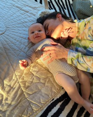 Chloe Bridges Instagram - Six months postpartum today 🤯🥹 Beau and I have giggled, cried, cuddled, had most of our hair fall out (y’all didn’t warn me about that one), grown, become better nappers, and learned a whole lot. He’s 2.5 weeks in the first slide and 5.5 months in the last… what do they say? The days are long but the years are short? I’m currently typing this as he is latched on my boob and I am still in last night’s pajamas (it’s 5:47 pm) so yeah that checks out lol