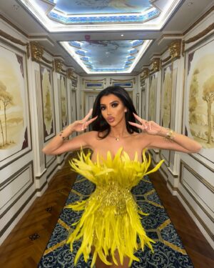Chloe Khan Instagram - @FashionNova for the Main Character Girlies 🦚 

🔎 Renee Sequin Feather Mini Dress - Chartreuse
