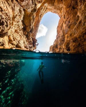 Chris Burkard Instagram - The over/under shot is a classic in surf & underwater photography, not an easy one to accomplish but provides a “through the looking glass” sort of perspective I think is important when contextualizing a sport or landscape that extends beneath the surface. Having spent countless hours lugging a housing around the world and taking my fair share of waves to the head for an angle I wanted - I always appreciate how much skill goes into to pulling off these kinds of images. 
This particular trip - Mallorca 2018, I wanted to show off both ends of deep water soloing, both the ascent & swim after that make the sport both unique but beautiful to capture & I felt that the over/under was the best approach.