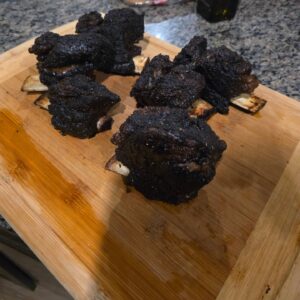 Chris Curtis Instagram - First crack at Short Ribs. Smoked them to 200, coated in Traeger blackened seasoning. Absolutely amazing. Insanely moist and tender. The bone pulled straight out. Think I'll only take them to 190 next time. But still, awesome results.