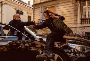 Christian Kane Instagram - This happened before the last video I sent. Which explains the heat exhaustion and really bad hair day. It’s very hard to slide over a car wearing jeans and 200lb size 11 high heel boots in the middle of 99 degree Serbian summers. But… we did it. Wait til you see what happens to the guy with the gun. #eliotspencer doesn’t like guns. #leverage #leverageredemption @officialdeandevlin @marcroskin @amazonprime