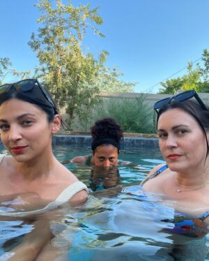 Christina Moses Instagram - impromptu photo shoot and a pool creeper. 🌴

aaand…we’re all wearing my new favorite lipstick..it’s very rare one color looks incredible on 3 different complexions.. @ritueldefille 💄🫦 #bloodroot my new fave. ❤️‍🔥